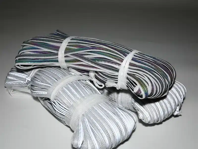 Several tied bundles of MP0103 piping with silver and multicolored highlights