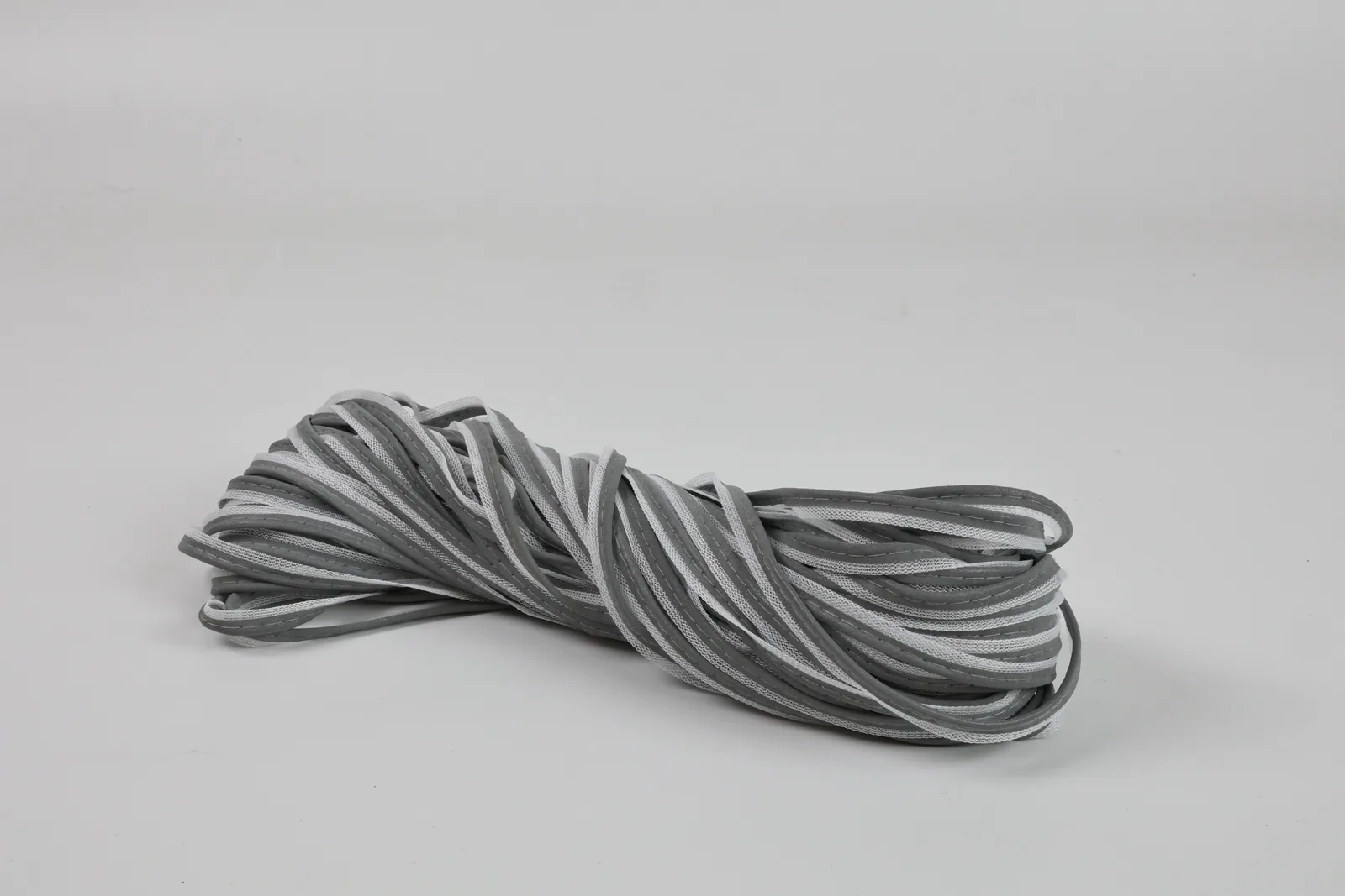 Folded MP0101 piping showing gray raised edges and white mesh flanges